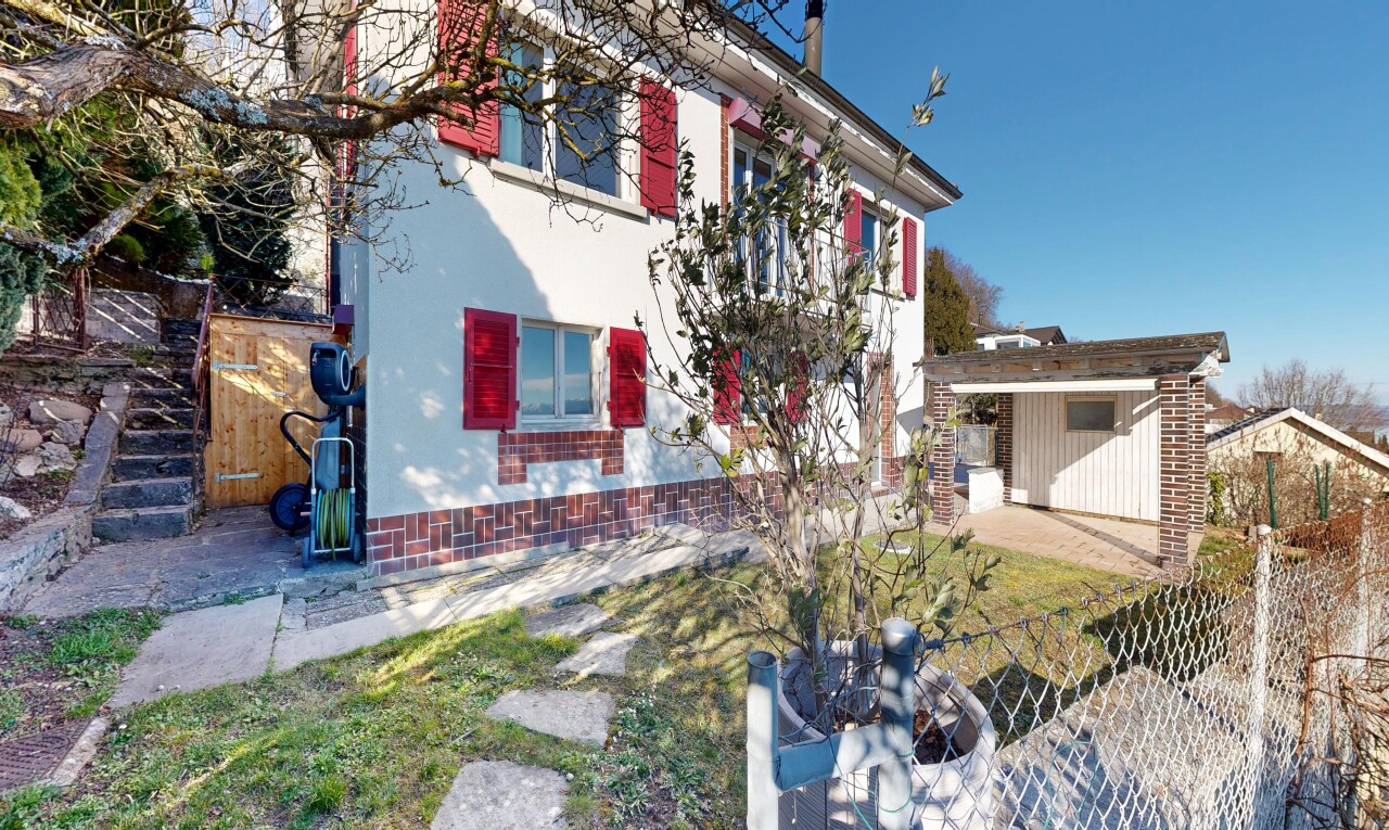 view of property with an outbuilding, a patio area, and stucco siding