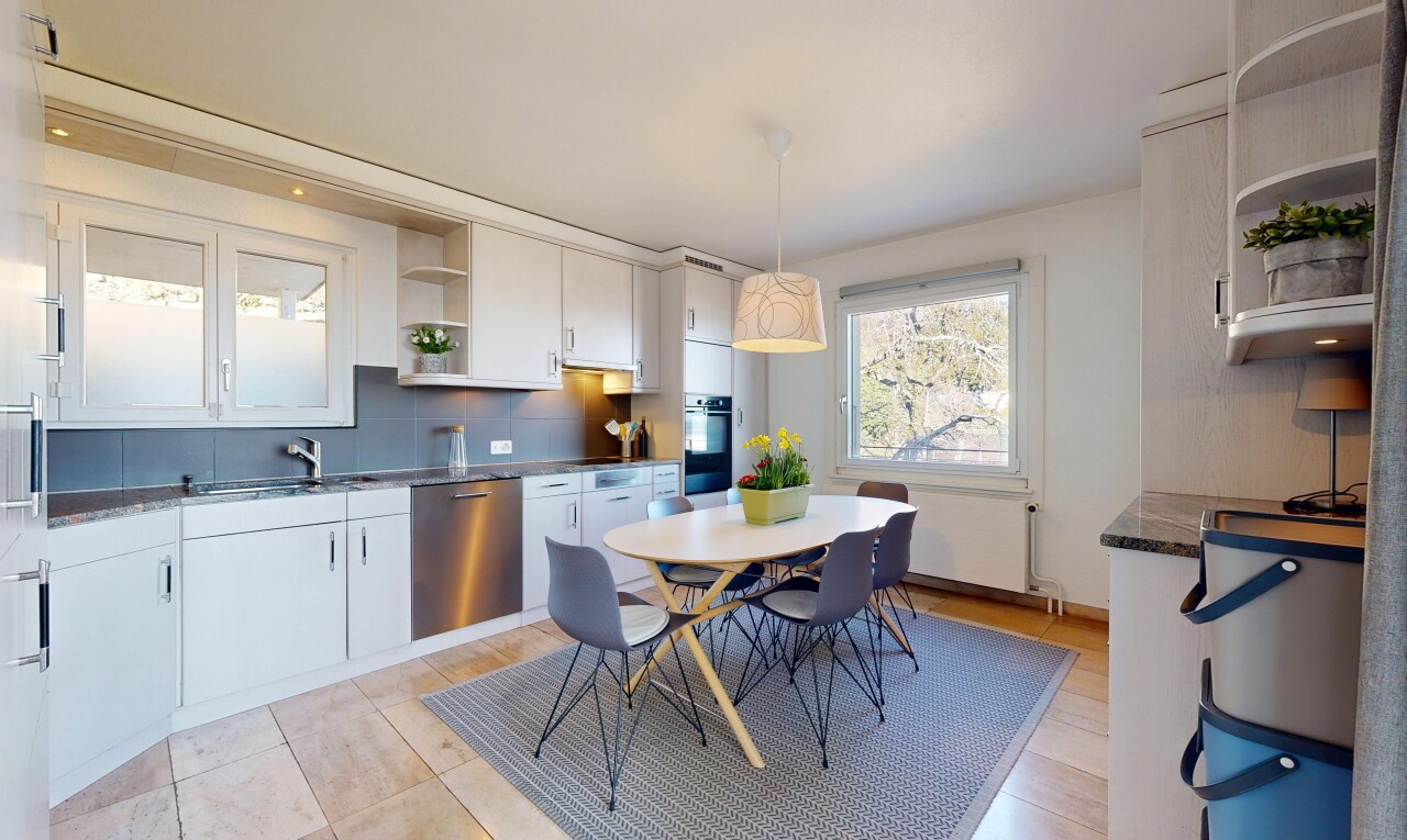 kitchen featuring open shelves, dark countertops, stainless steel dishwasher, hanging light fixtures, and tasteful backsplash