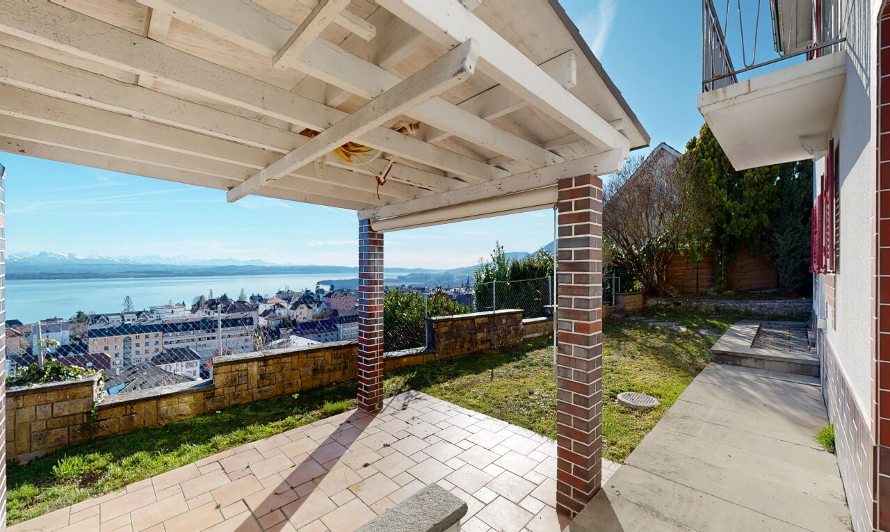 terrace with a water view and a patio area
