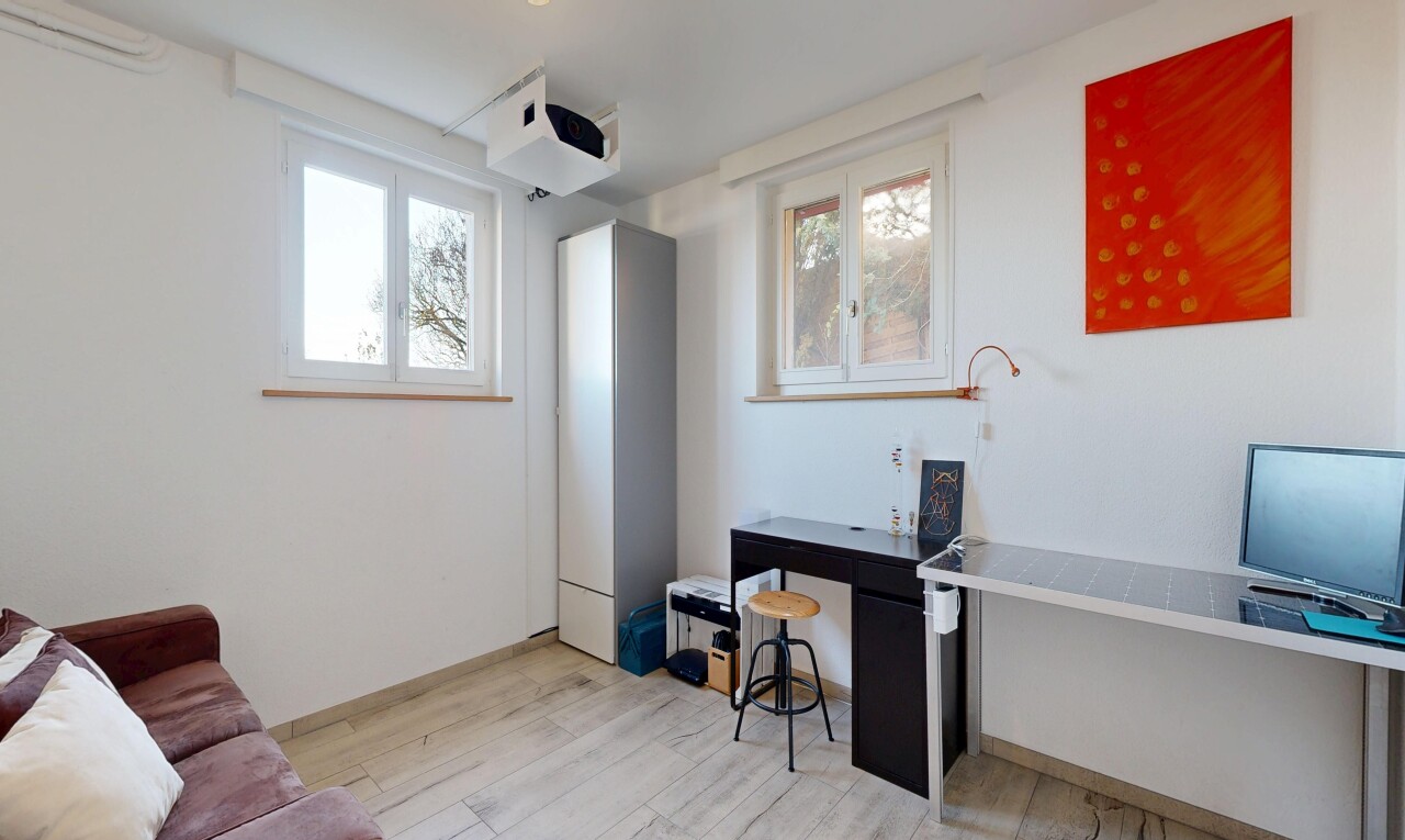 living room with an office area and light wood-style floors