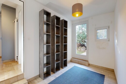 unfurnished room with baseboards and light wood-style flooring