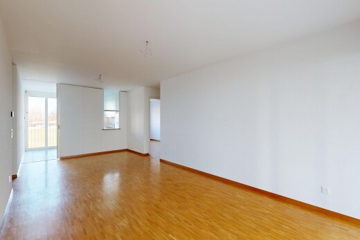 pièce vide avec inside property, sol en finition bois, wood finish floor, cloison sèche, et drywall