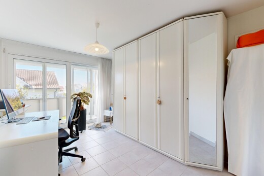 office area with decorative light fixtures and light tile patterned floors