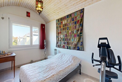 room with baseboards and a barrel ceiling