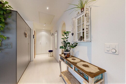 hall featuring recessed lighting and attic access