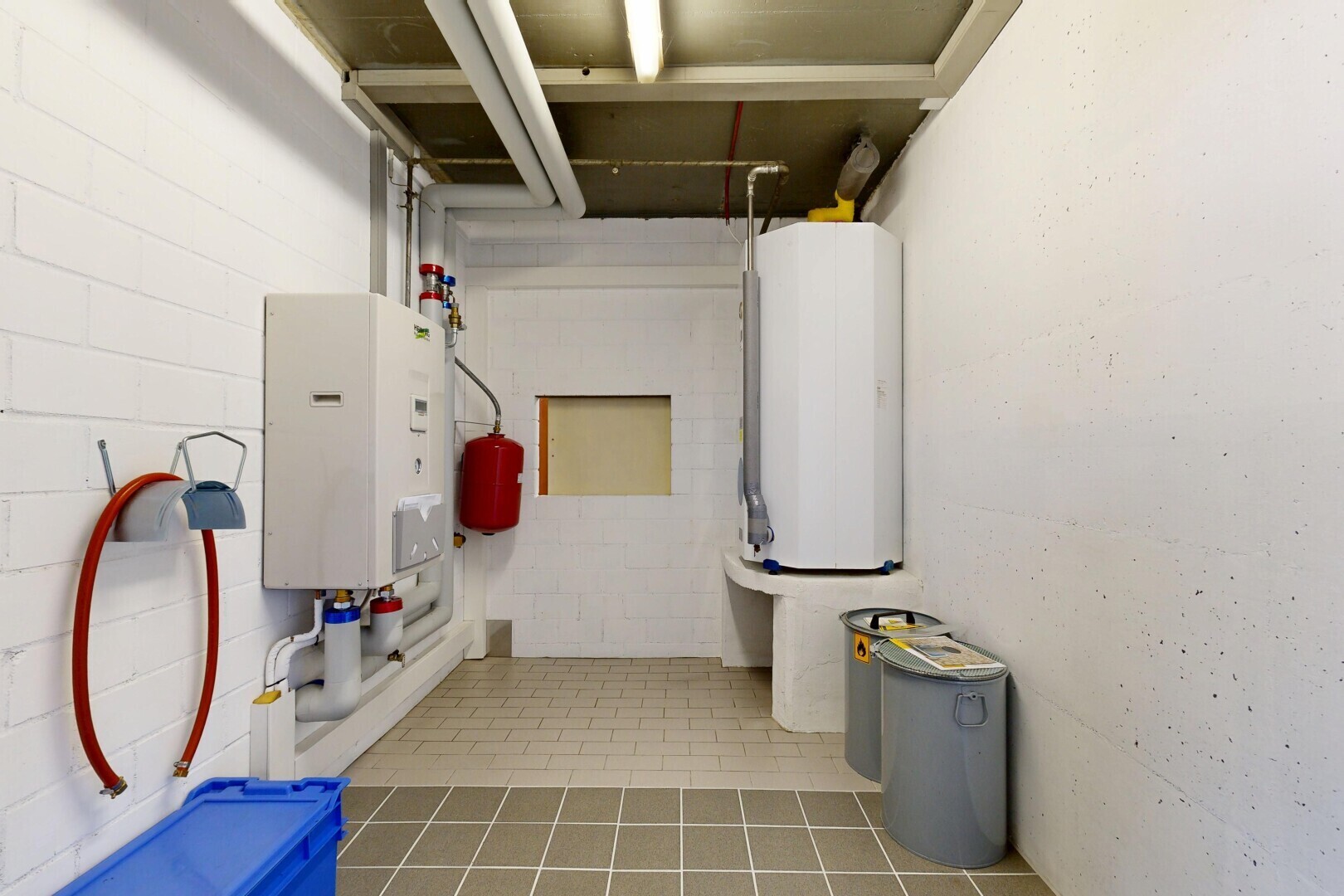 laundry room featuring water heater