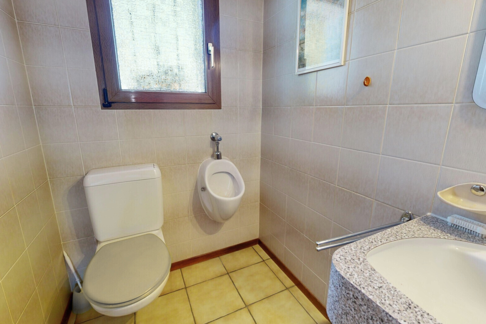 bathroom featuring tile walls, vanity, plenty of natural light, and light tile patterned flooring