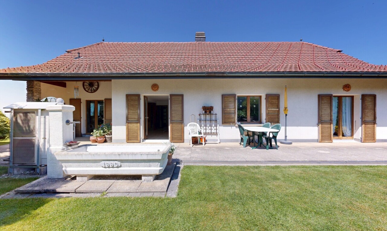 outdoor house featuring a yard, stucco siding, and a patio area
