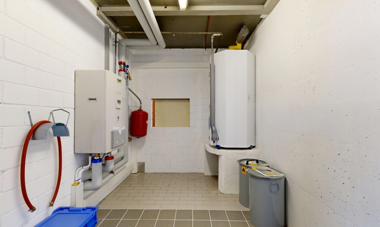 laundry room featuring water heater