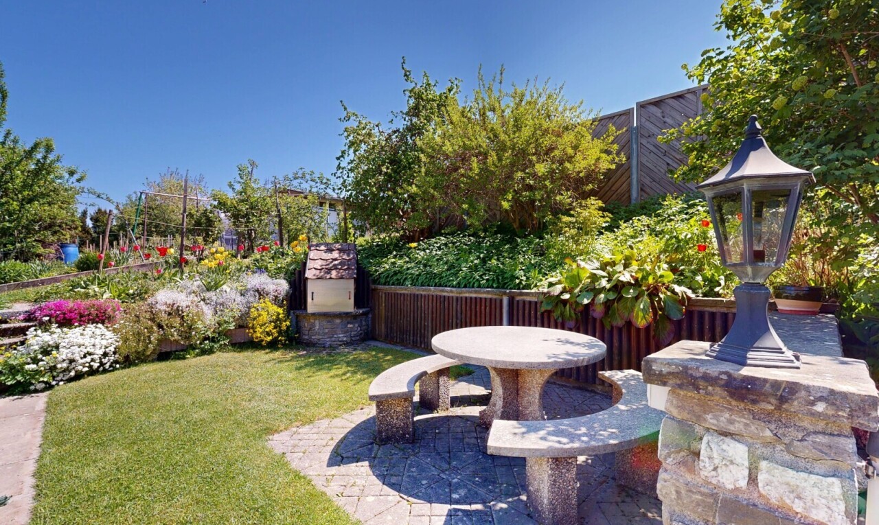 garden featuring a patio area and a yard