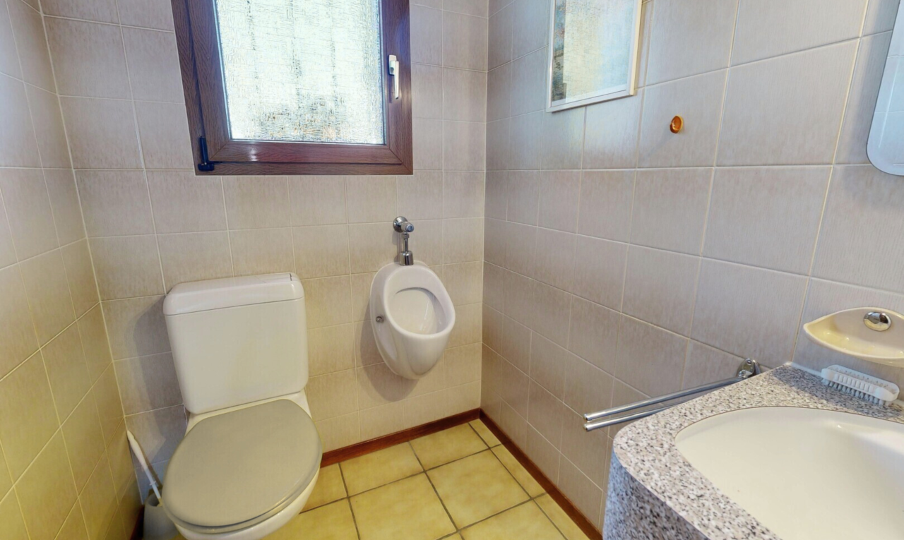 bathroom featuring tile walls, vanity, plenty of natural light, and light tile patterned flooring