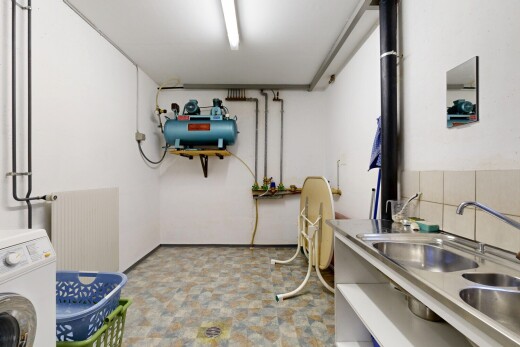 laundry area featuring washer / clothes dryer and radiator heating unit