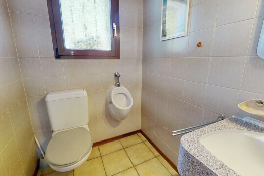 bathroom featuring tile walls, vanity, plenty of natural light, and light tile patterned flooring