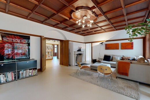 salon avec finished concrete floor, plafond à caissons, coffered ceiling, cloison sèche, et drywall