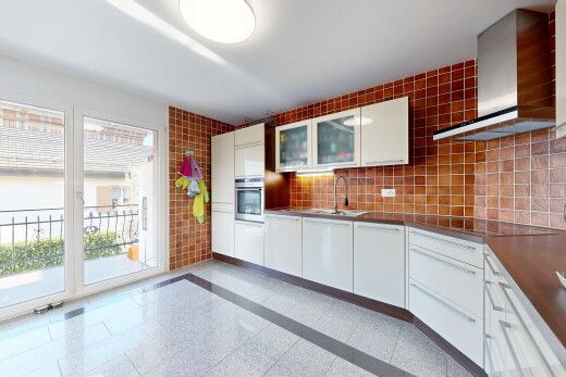 kitchen featuring glass fronted cabinets, white cabinets, stainless steel oven, decorative backsplash, and dark countertops