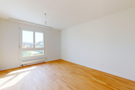 pièce vide avec drywall, cloison sèche, wood finish floor, sol en finition bois, et inside property