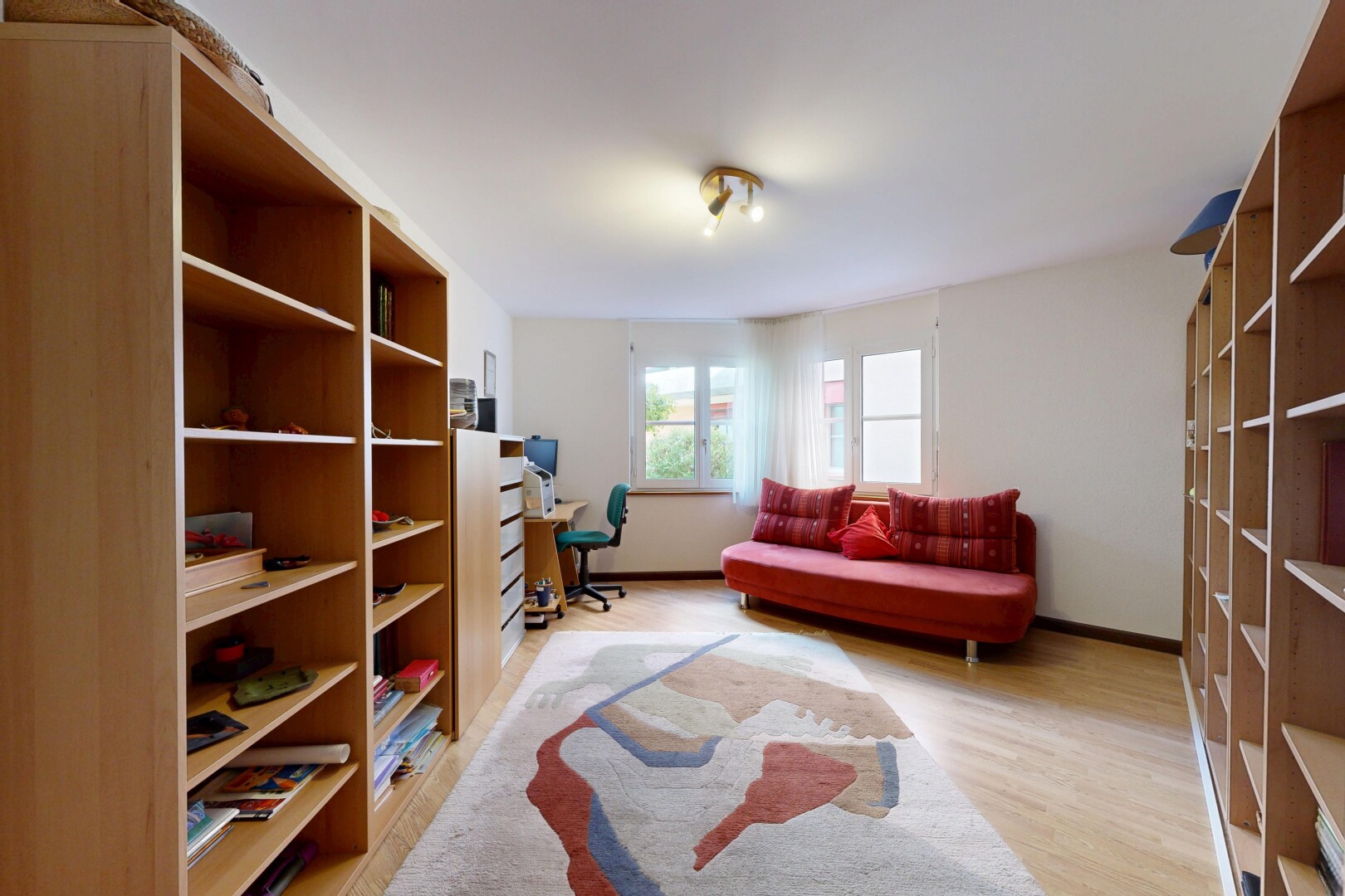 living room with light wood-style flooring and baseboards
