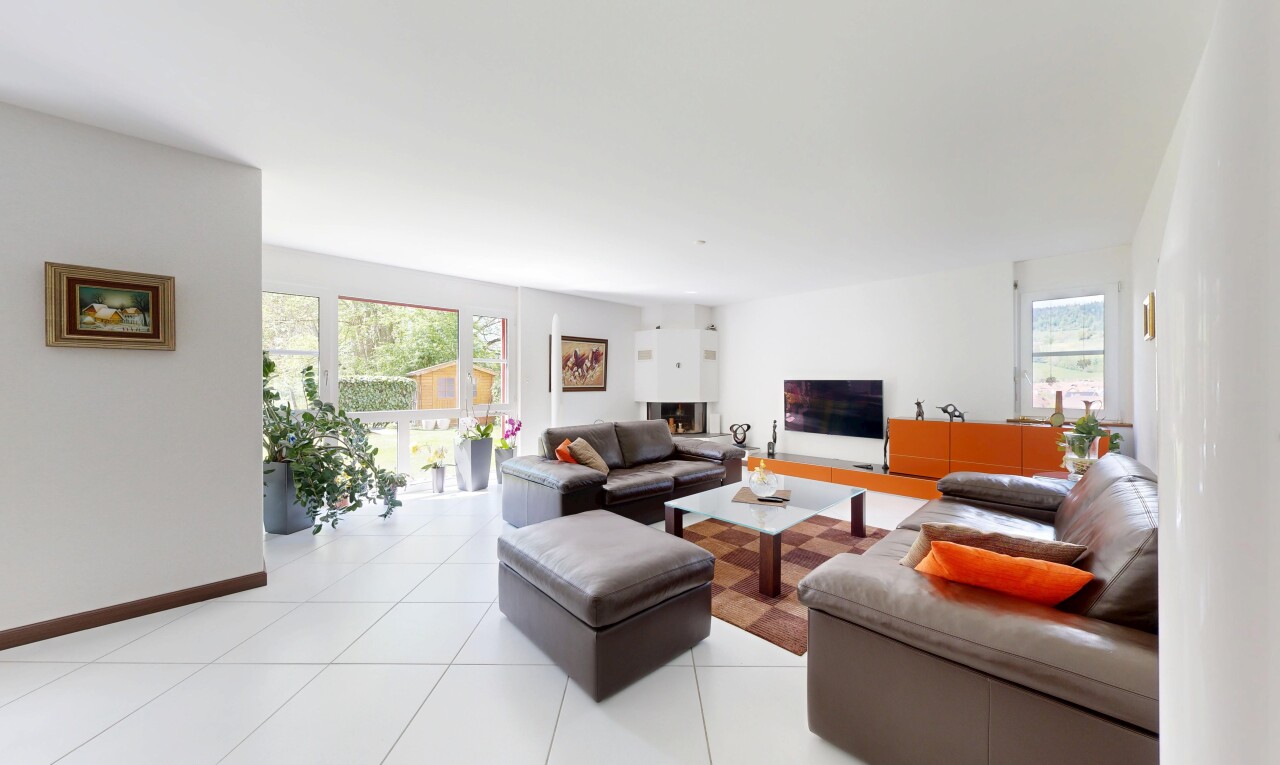living room featuring plenty of natural light and light tile patterned flooring