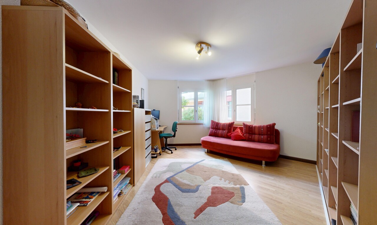 living room with light wood-style flooring and baseboards