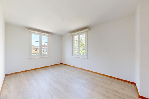 pièce vide avec cloison sèche, drywall, plinthes murales, baseboards wall, et light floor