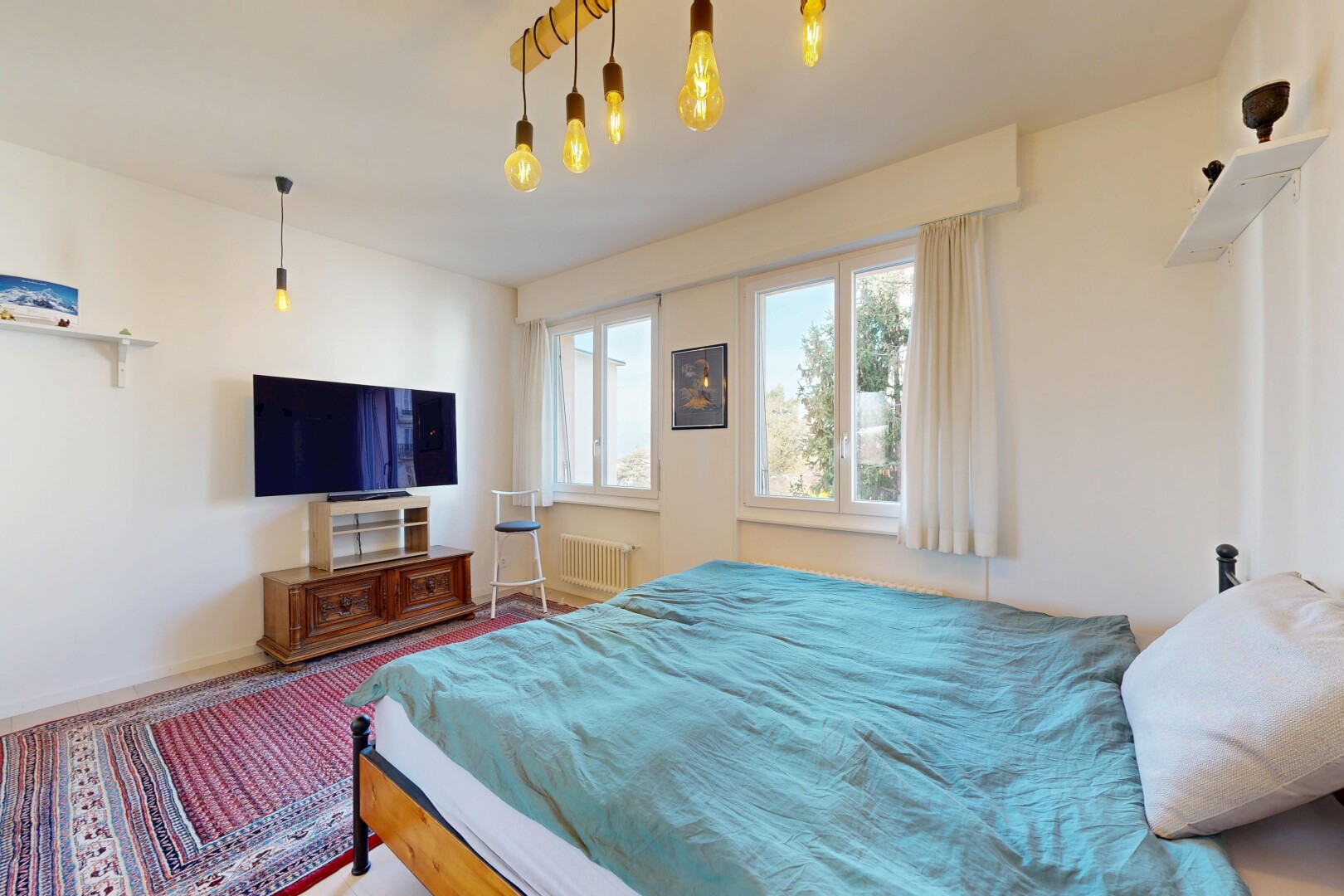room featuring radiator heating unit and carpet