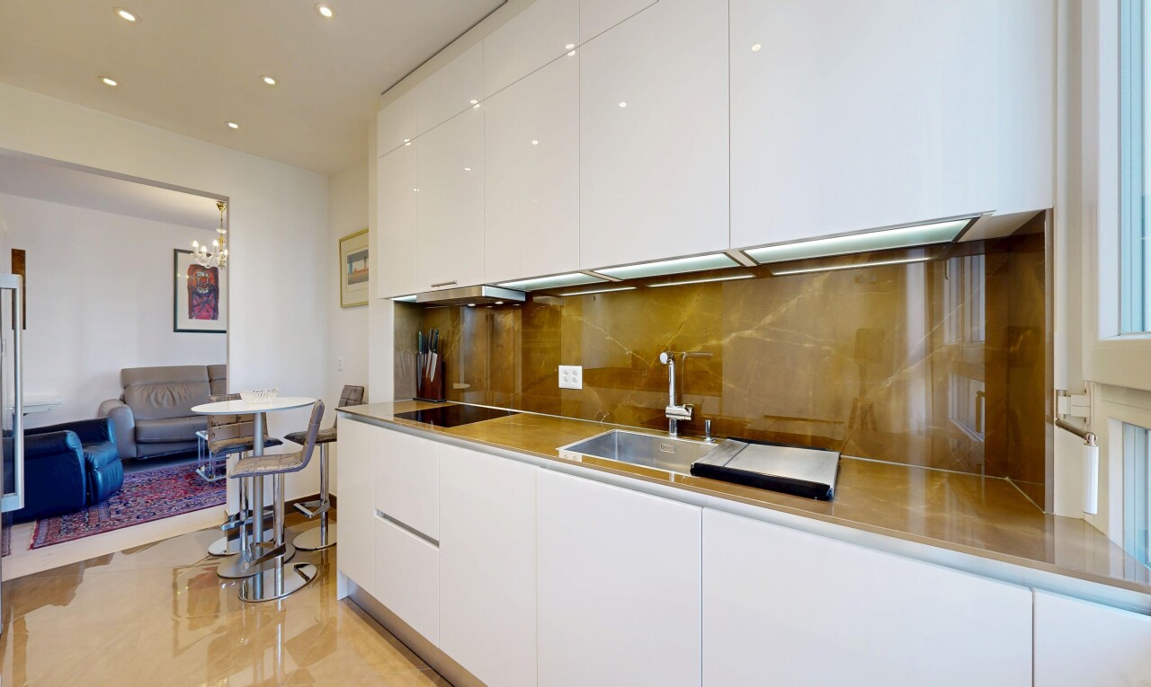 kitchen featuring white cabinetry, modern cabinets, decorative backsplash, recessed lighting, and black electric stovetop
