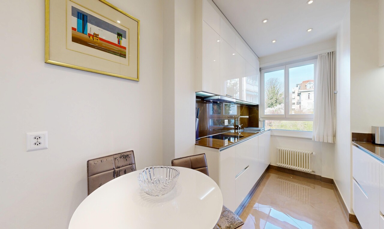 kitchen with modern cabinets, white cabinets, radiator, recessed lighting, and black electric stovetop