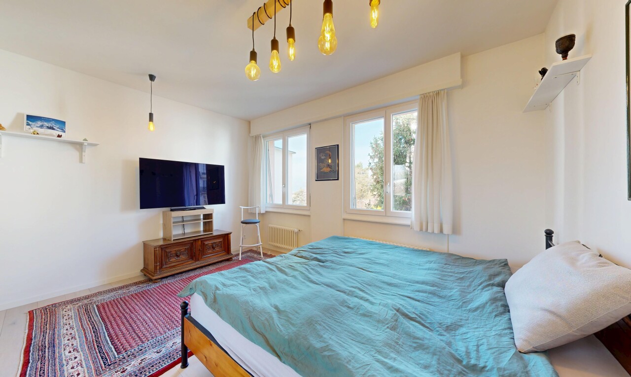 room featuring radiator heating unit and carpet
