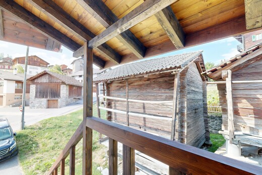 view of property featuring an outbuilding and an exterior structure
