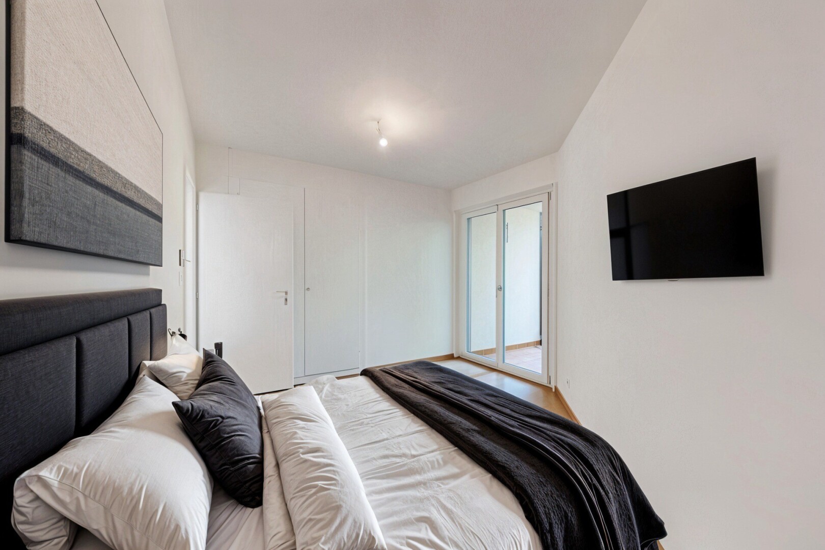 spare room featuring light wood-style flooring and baseboards