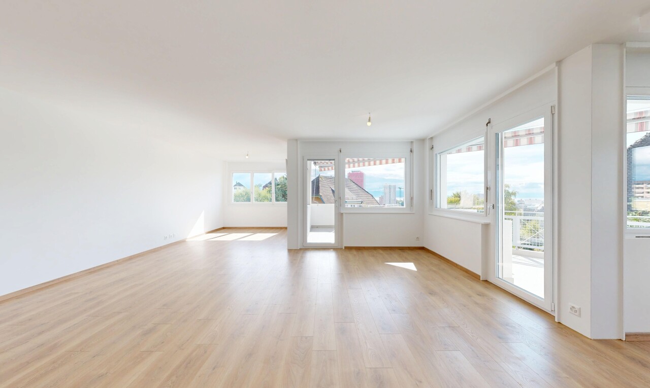 empty room with light wood-type flooring and baseboards
