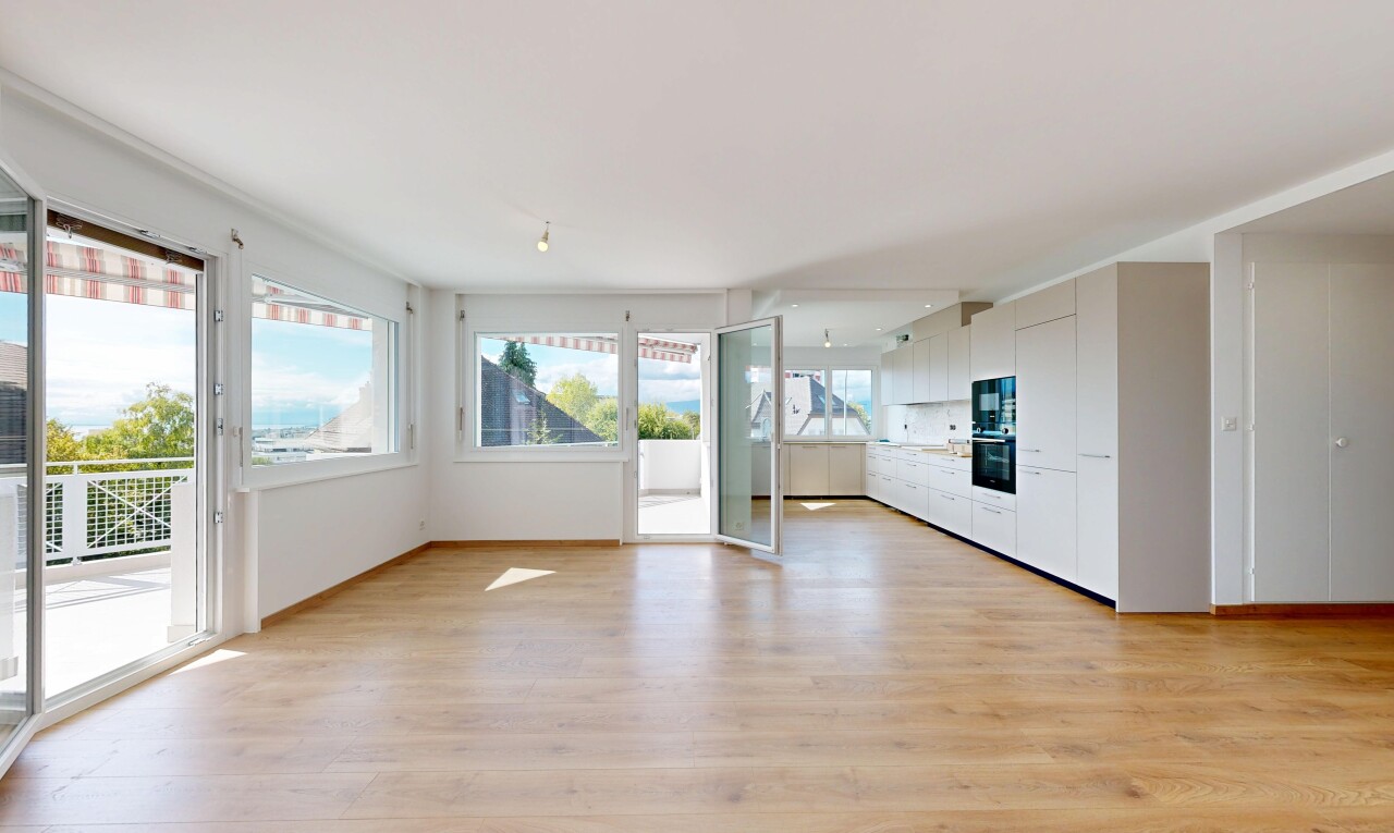 empty room featuring light wood-type flooring and baseboards