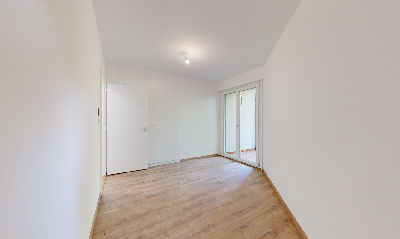 spare room featuring light wood-style flooring and baseboards