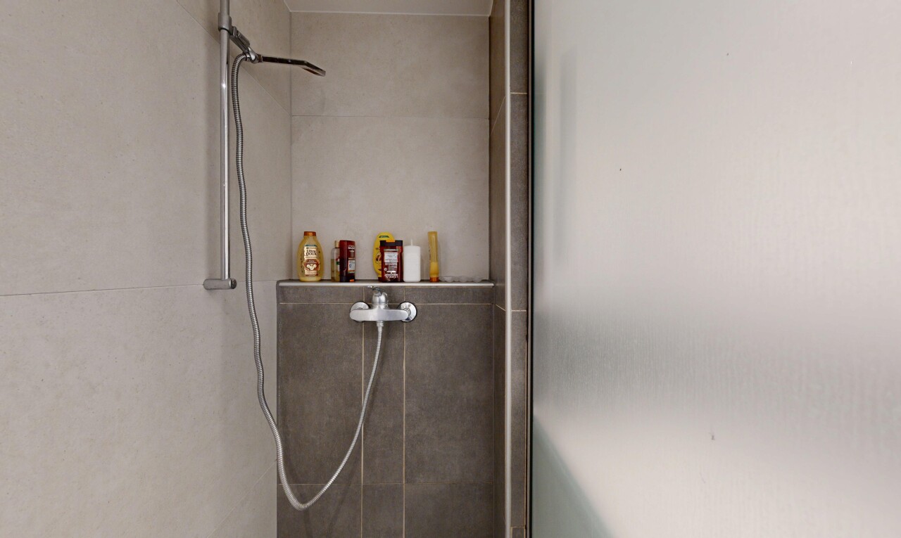 bathroom with a tile shower