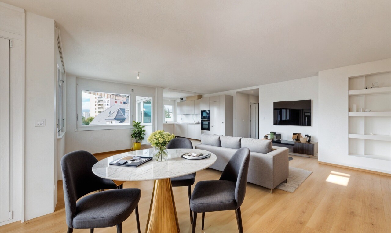 unfurnished room featuring built in shelves and light wood finished floors