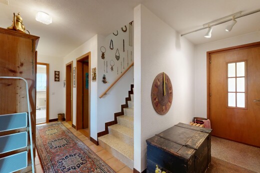 staircase featuring track lighting and plenty of natural light