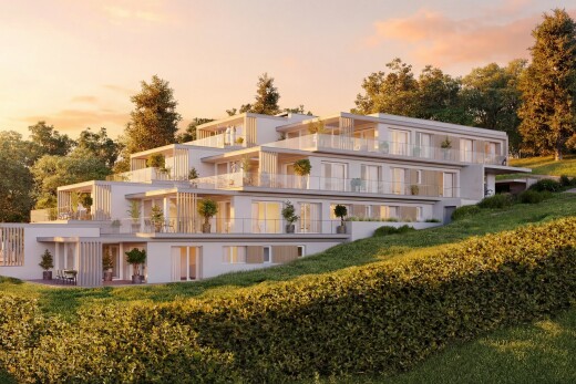 outdoor house at dusk with a balcony and a patio area