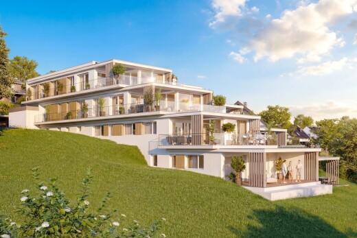 view of home with a balcony, a lawn, and a patio