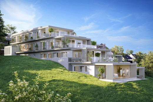 view of property with a yard, a balcony, and a patio area