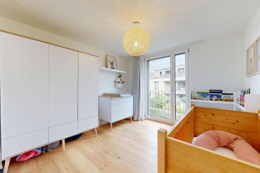 chambre avec wood finish floor, sol en finition bois, drywall, cloison sèche, et inside property
