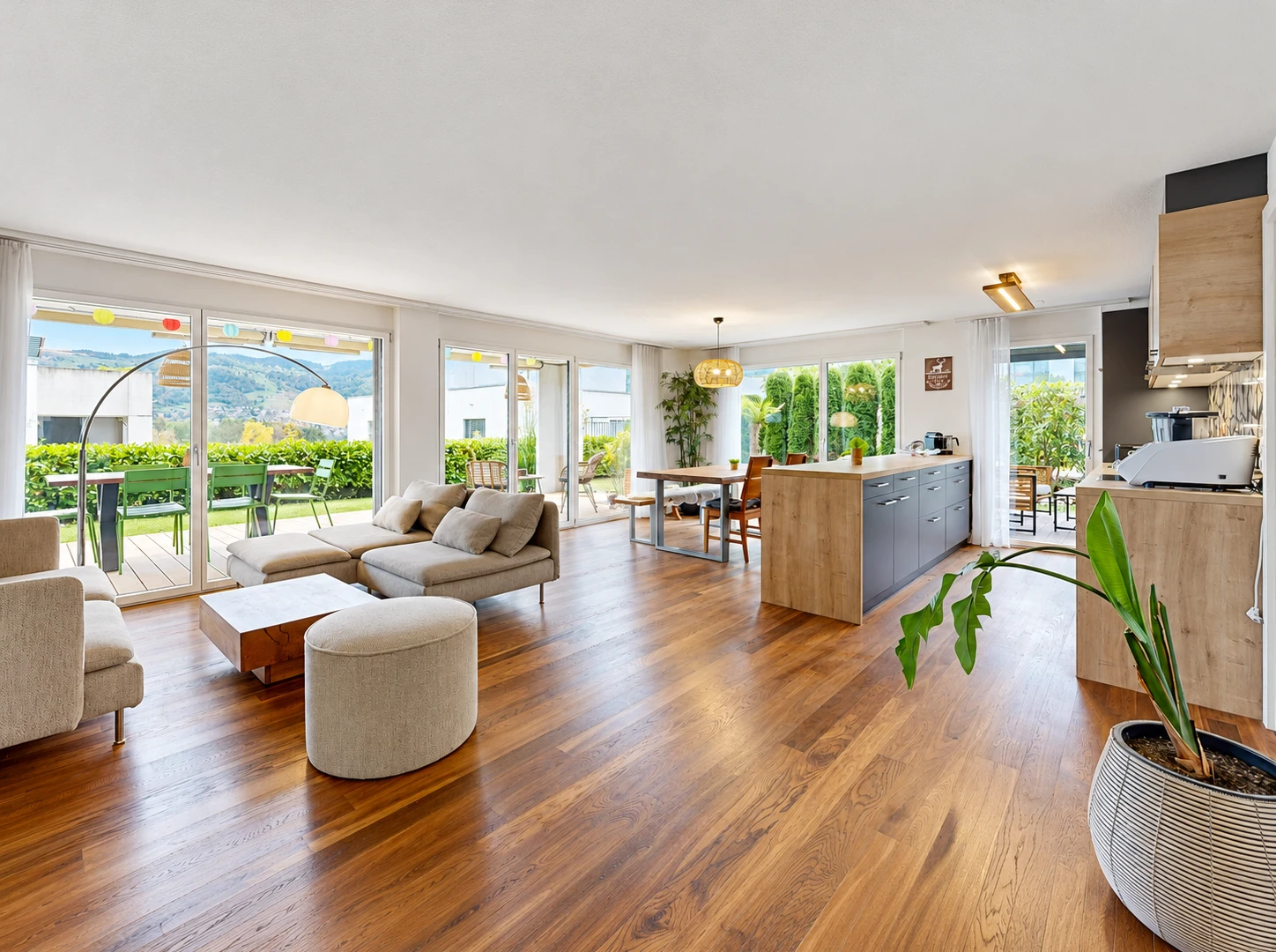 living / dining area with access to outside and wood finished floors