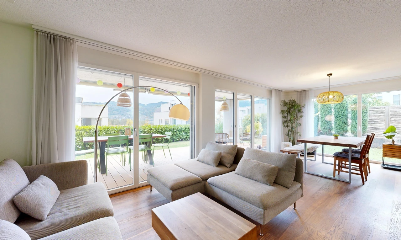 living / dining room featuring access to exterior and light wood-style floors