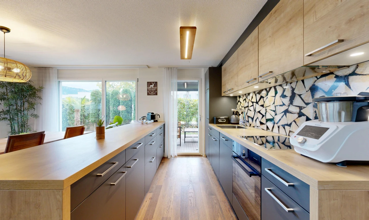 kitchen with light countertops, black appliances, modern cabinets, and access to outside