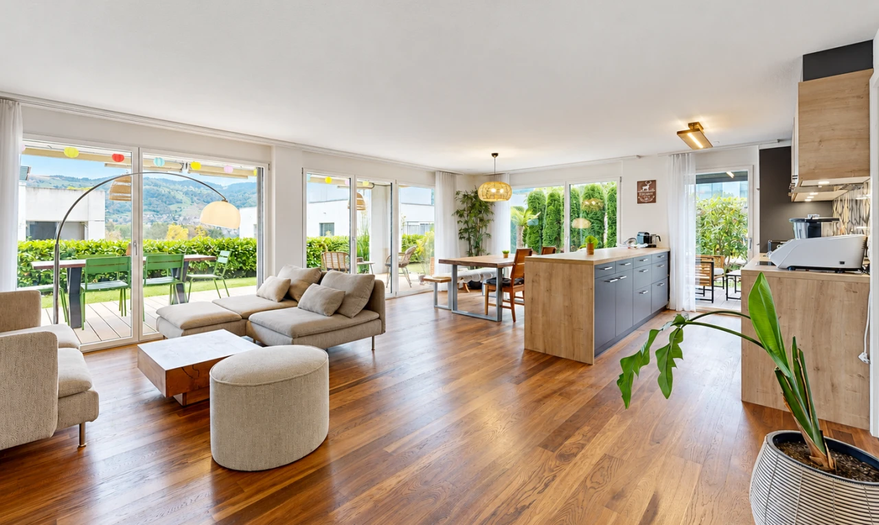 living / dining area with access to outside and wood finished floors