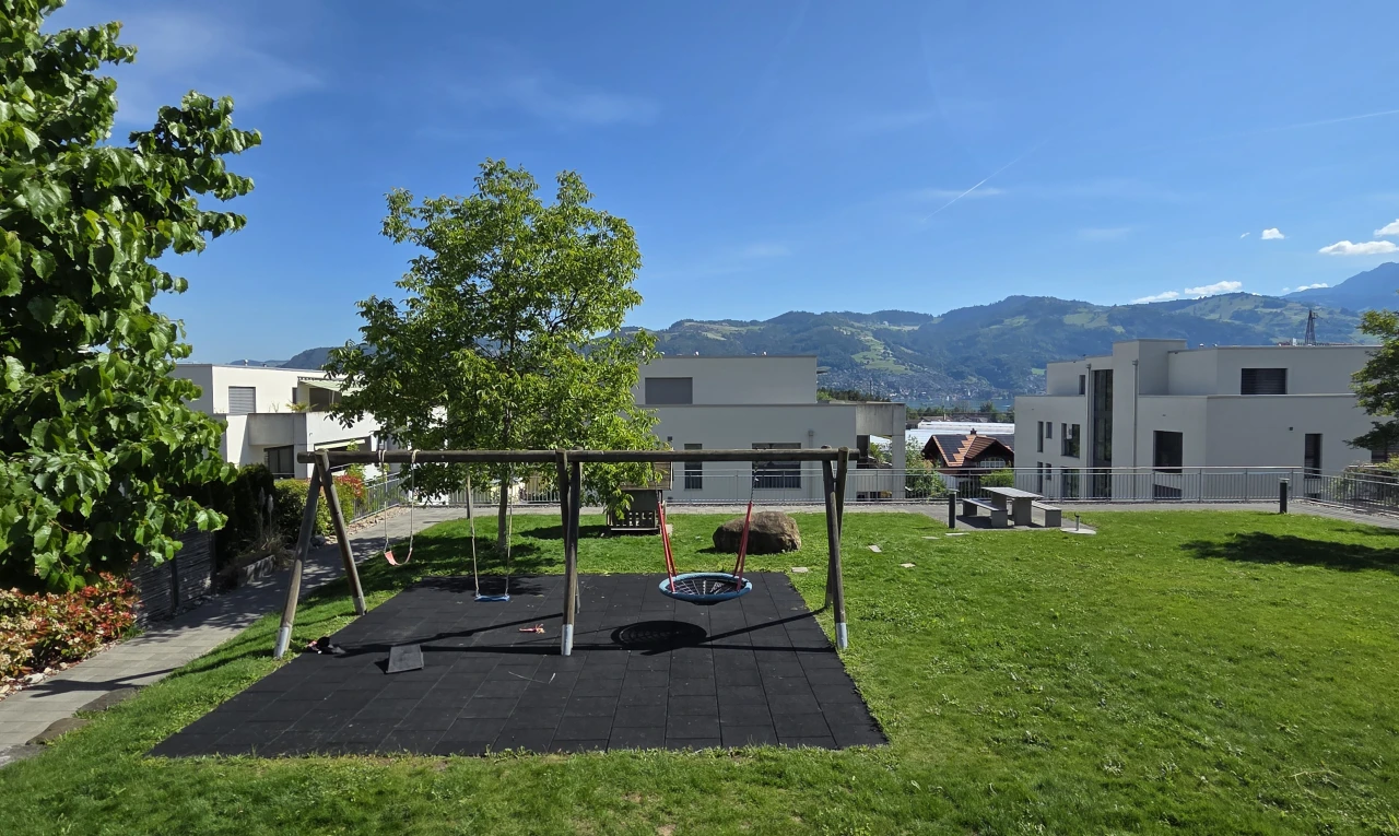 exterior space with a mountain view and a patio area
