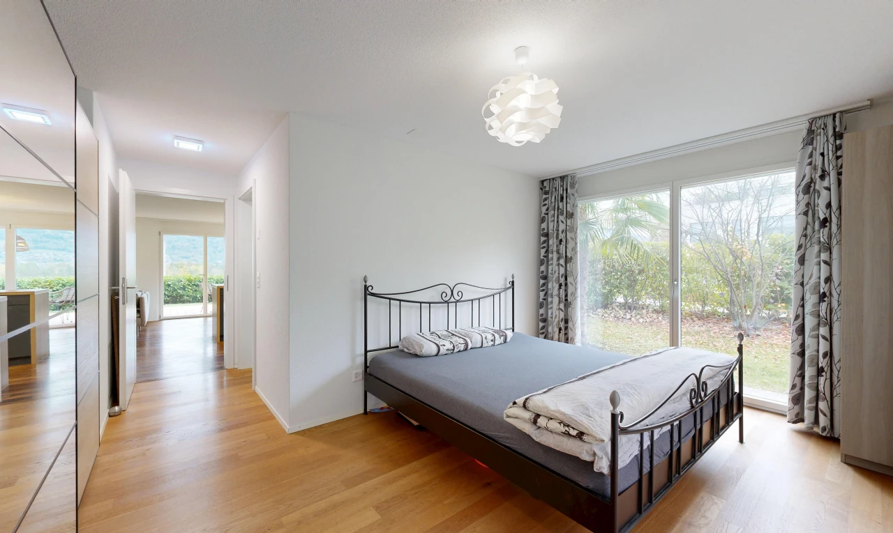 room / bedroom featuring light wood finished floors and access to exterior