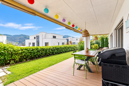 patio / terrace featuring grilling area, a deck with mountain view, and outdoor dining area