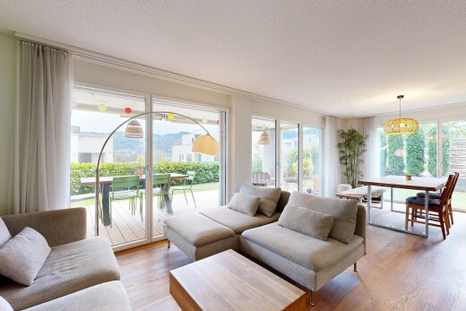 living / dining room featuring access to exterior and light wood-style floors