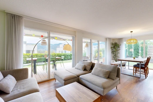 living / dining room featuring access to exterior and light wood-style floors