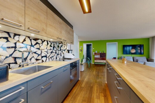 kitchen with modern cabinets, open floor plan, wooden counters, dark wood-style flooring, and black oven